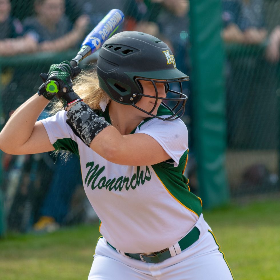 A softball player at bat
