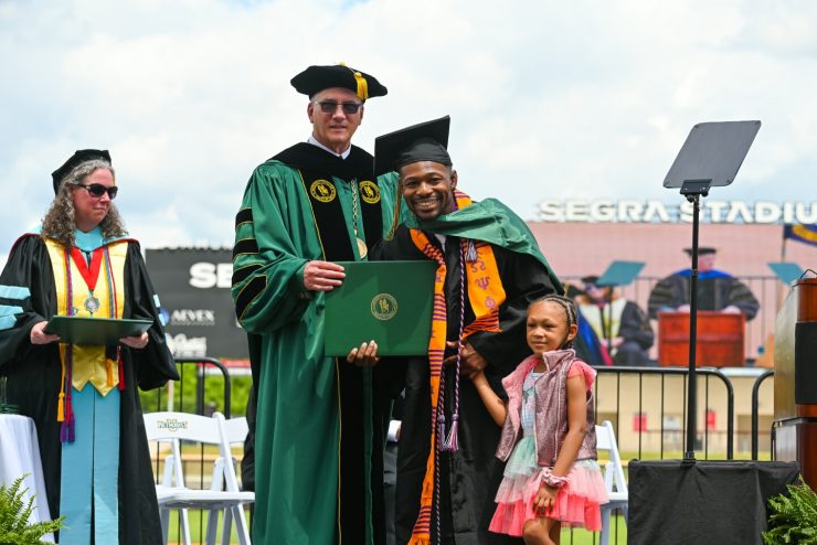 President Stanley T. Wearden, a graduate and his daughter