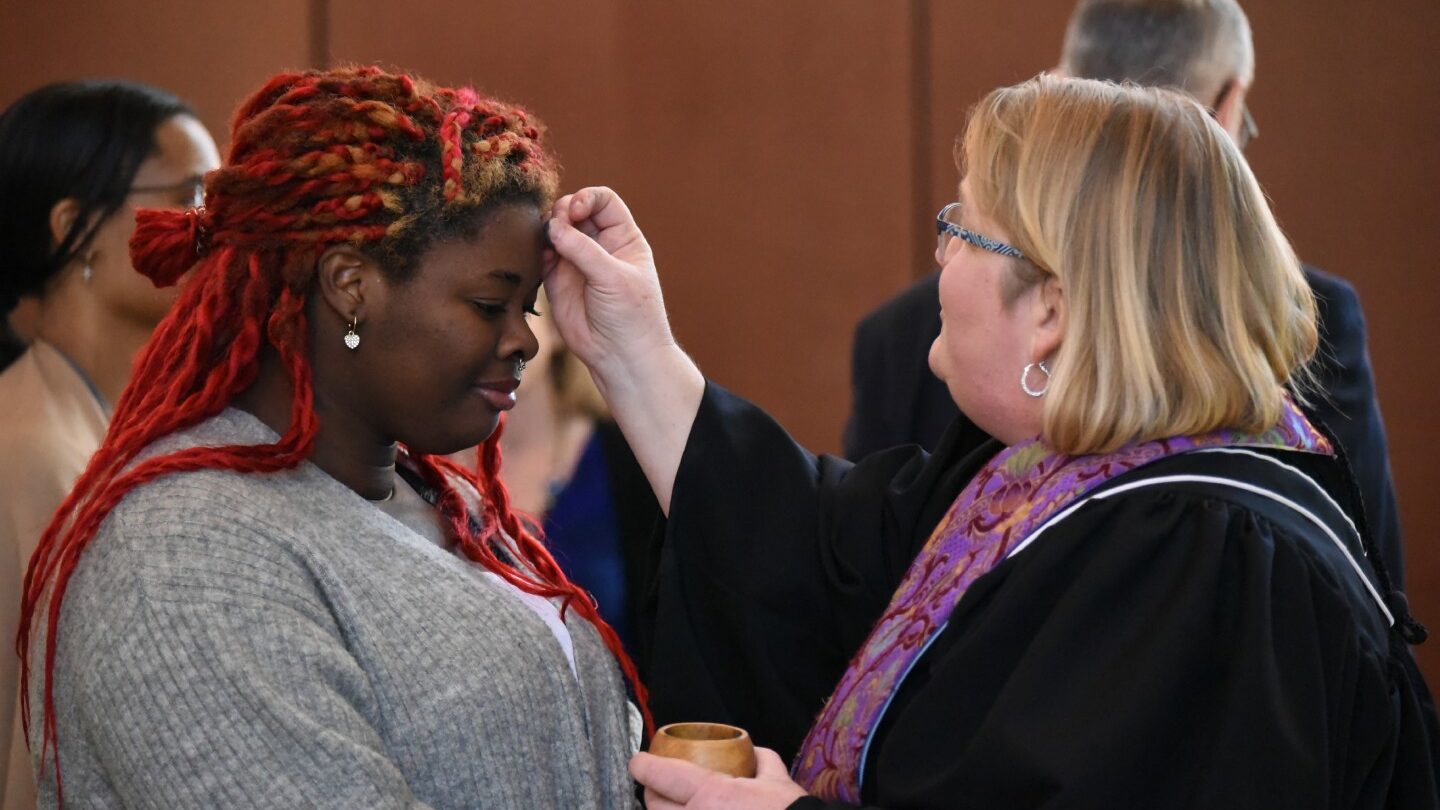 Rev. Kelli Taylor administers ashes on Ash Wednesday