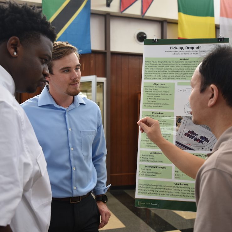 Students speak with professor during CRC Symposium at Methodist University