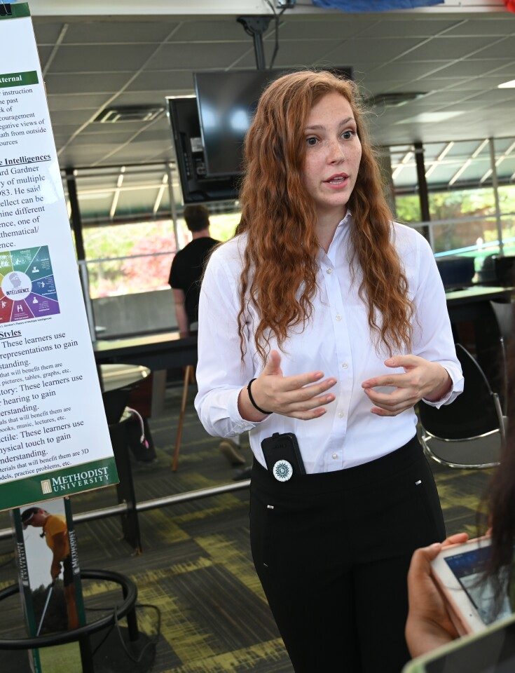A student presents at the annual Center for Research & Creativity Symposium