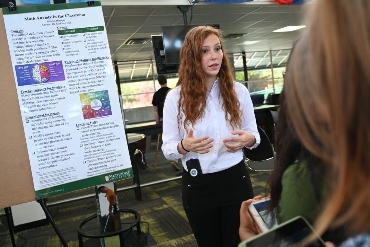 A student presents at the annual Center for Research & Creativity Symposium