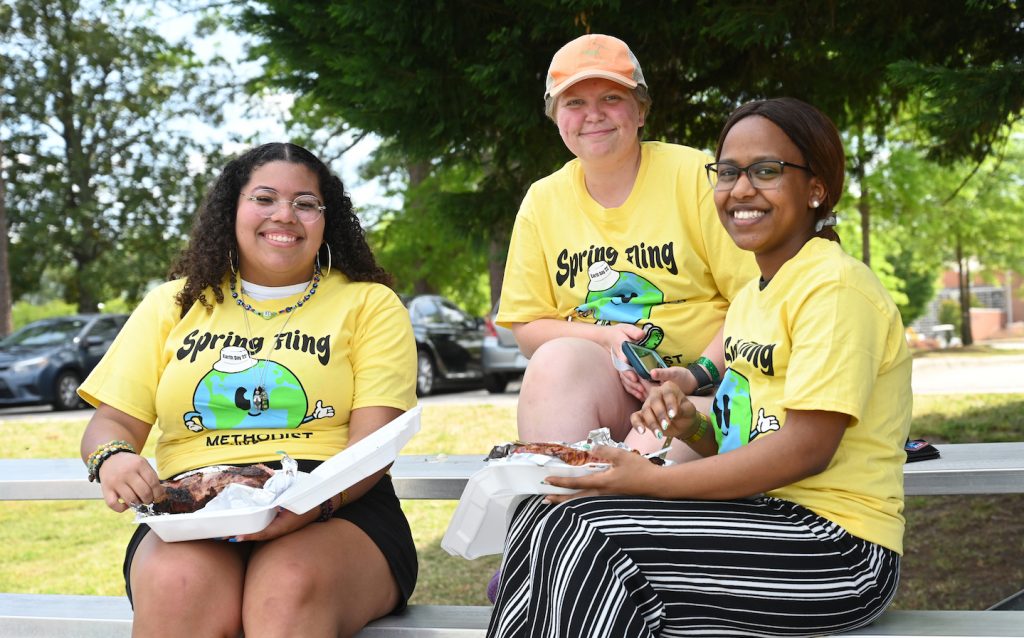 Students hang out and eat food during Spring Fling at Methodist University
