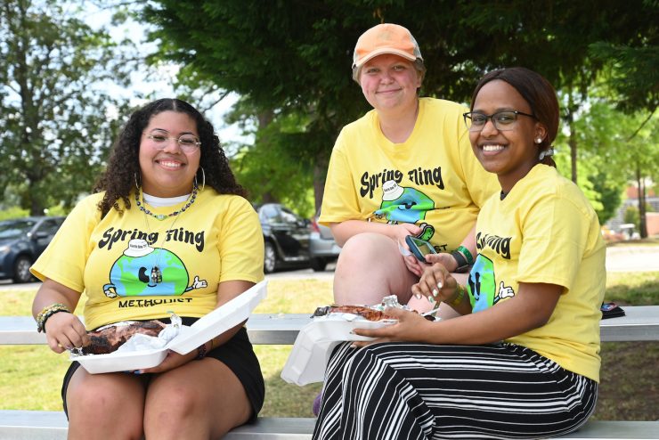 Students hang out and eat food during Spring Fling at Methodist University