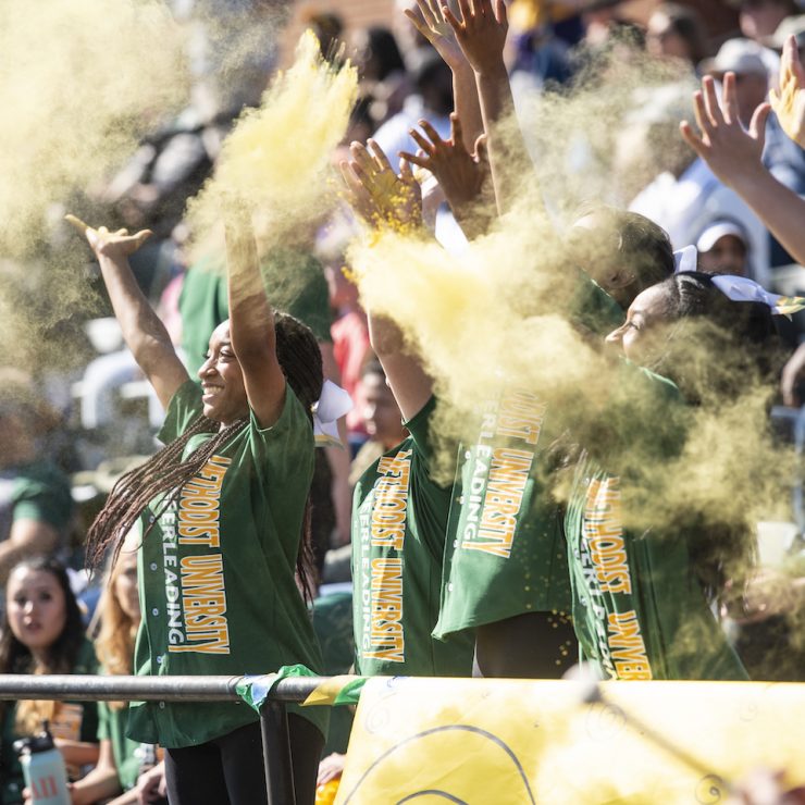 Students cheering at a Methodist University football game