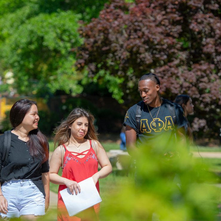 Diverse Methodist University students walking on campus