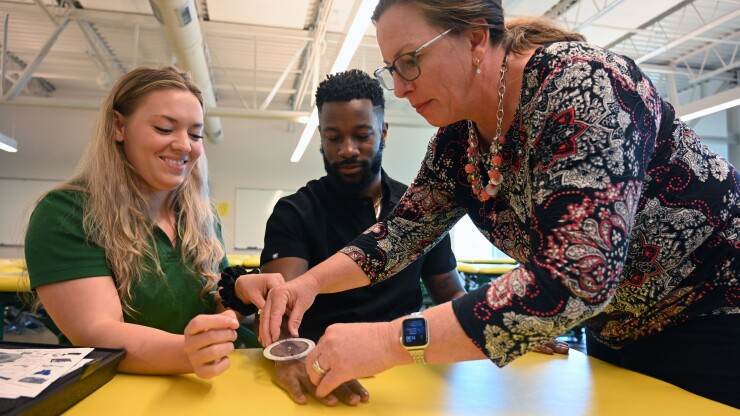 Dr. Amy Haynes teaches two Occupational Therapy students
