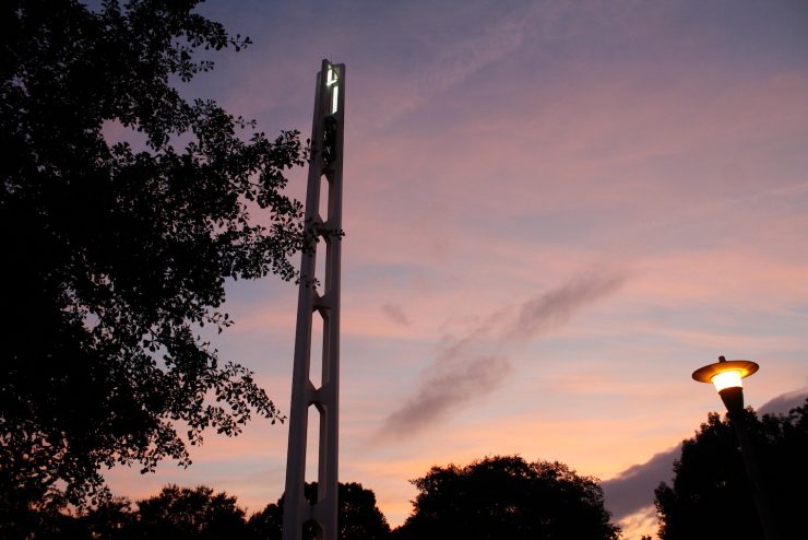Methodist University bell tower with night sky