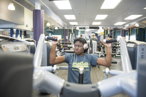 A student exercises in Nimocks Fitness Center