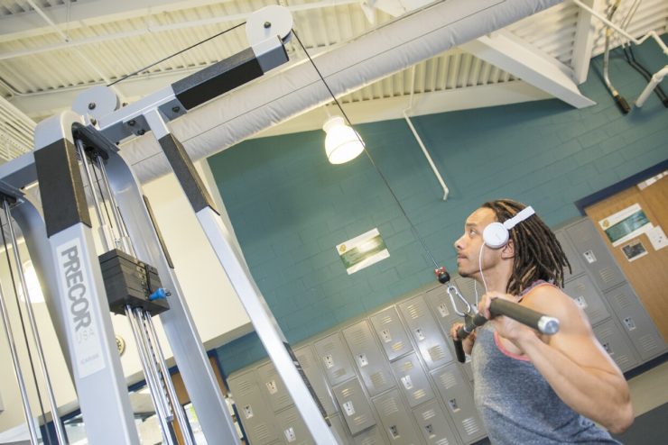 A student exercises in Nimocks Fitness Center