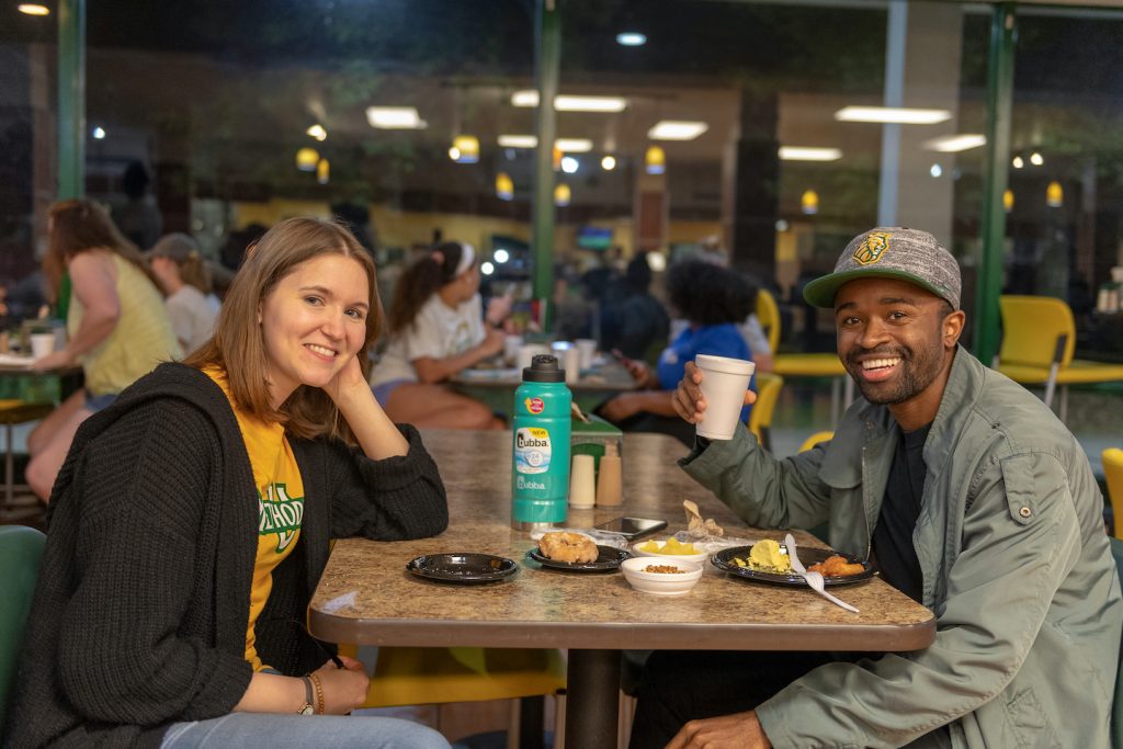 Two students eating together at Methodist University's dining hall