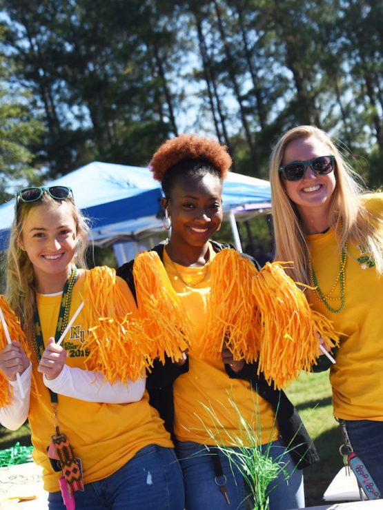 Students hanging out together at Methodist University's Homecoming tailgate
