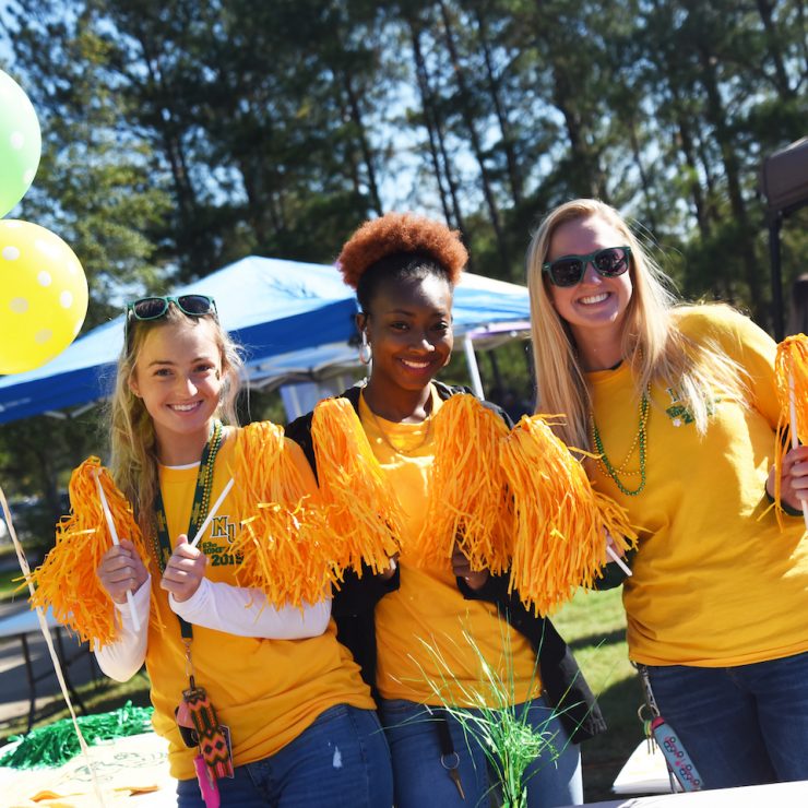 Students hanging out together at Methodist University's homecoming tailgate