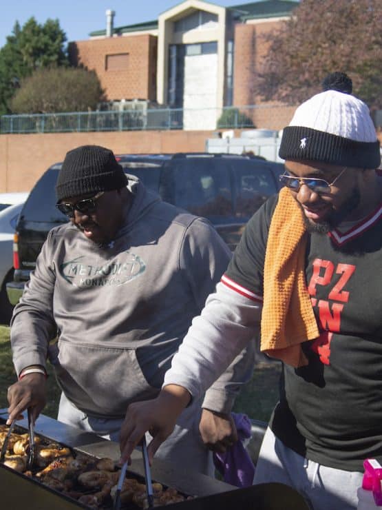 Methodist University alumni cooking together at Homecoming