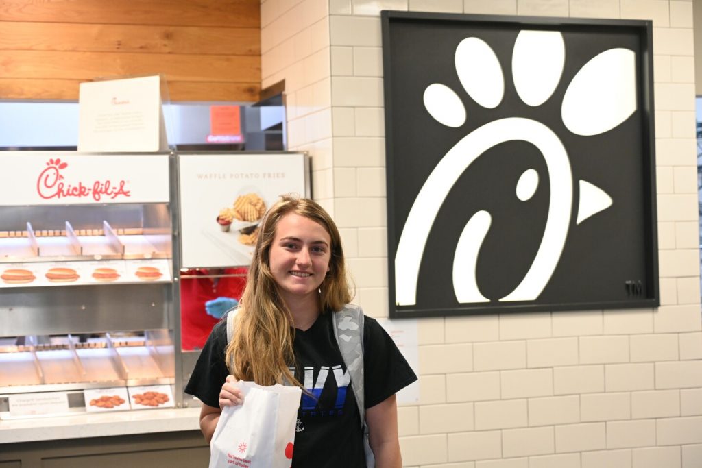 A student enjoys lunch from Chick-fil-A