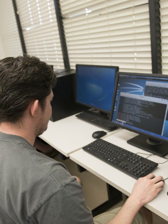 A student works in the Digital Forensics lab