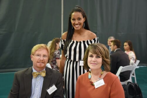 An endowed scholarship recipient poses with the donors