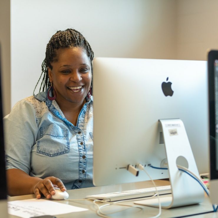 A student works in the graphic design lab