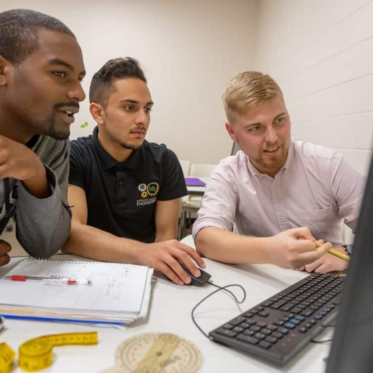 Engineering students using a computer