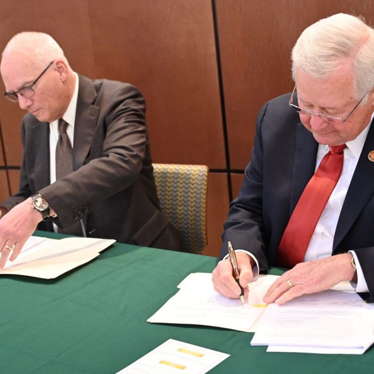 President Stan Wearden of Methodist University and President J. Larry Keen of Fayetteville Technical Community College sign a memorandum of understanding