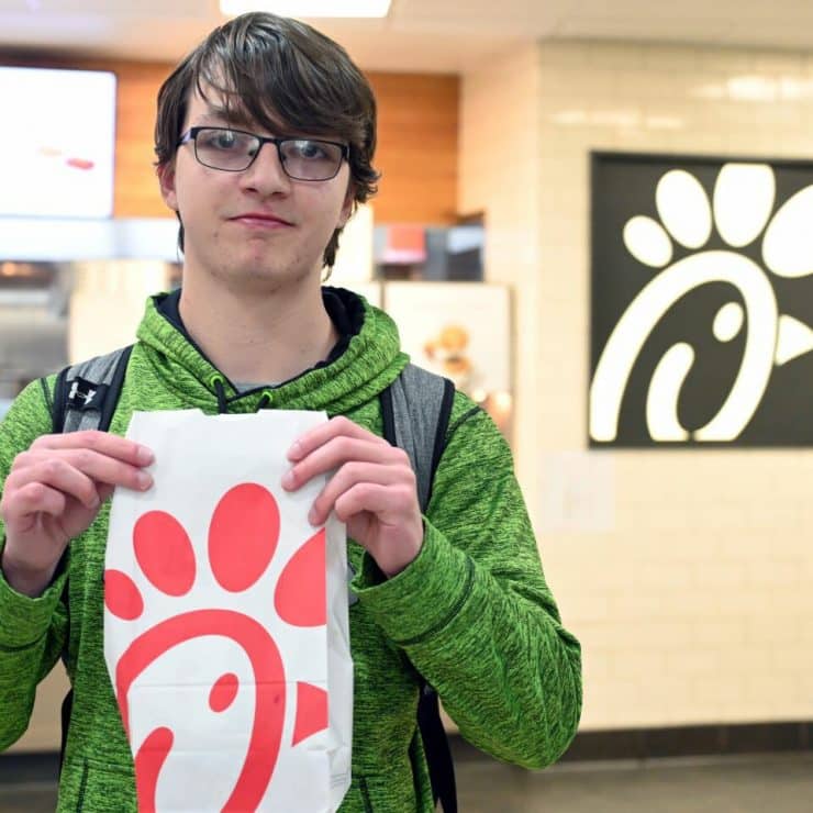 A student gets lunch from Chick-fil-A
