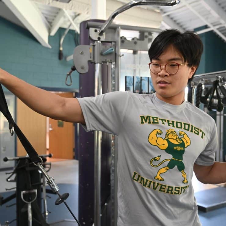 Student working out at Nimocks Fitness Center at Methodist University
