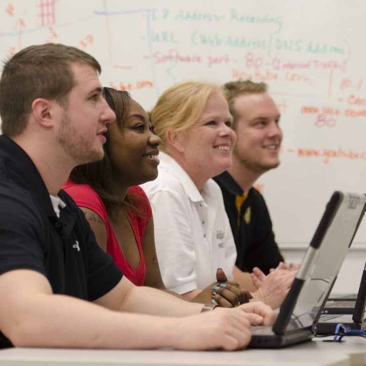 Students with computers at Methodist University
