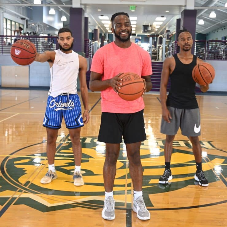 Methodist University students pose on the basketball court of Nimocks Fitness Center