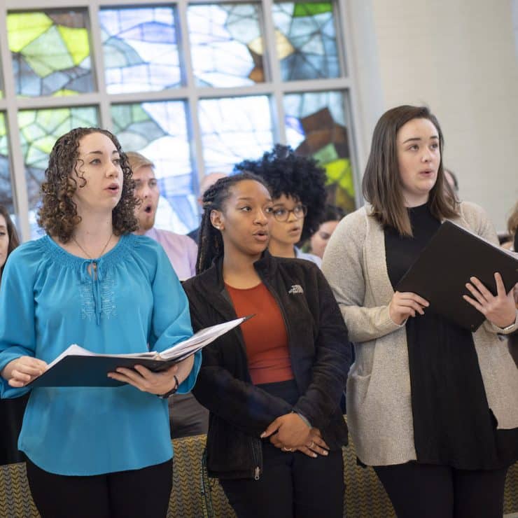 Students sing during a CIRCUIT service at Methodist University