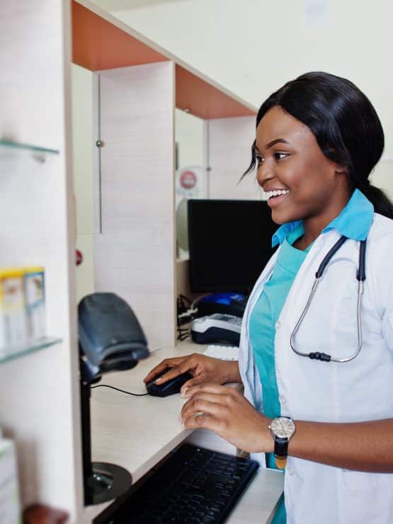 African american pharmacist working in drugstore at hospital pharmacy. African healthcare.