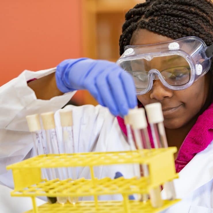 A chemistry student working in the lab