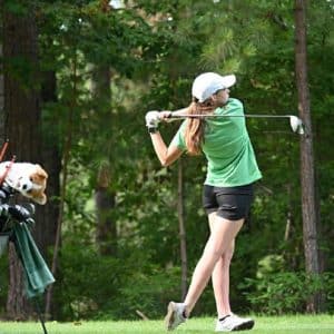 A Summer Experience golfer swings