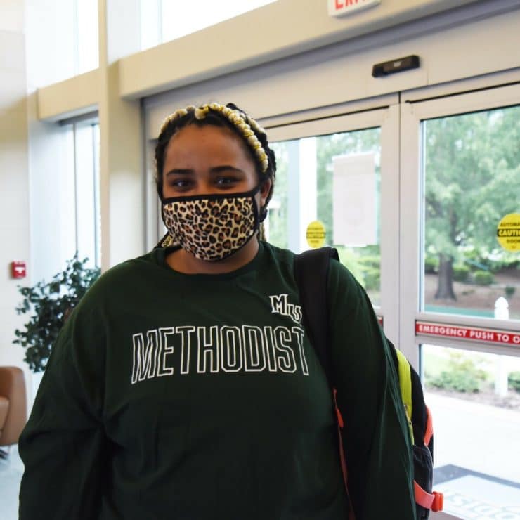A student wears a mask