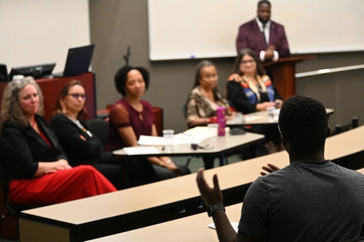 A student asks a question at the 25th B. F. Stone Lyceum