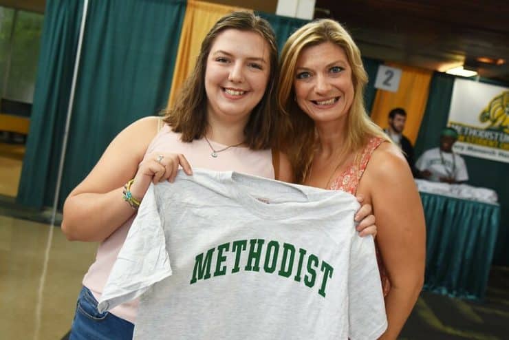 Freshman Josie Samuelian poses with a t-shirt at New Student Orientation