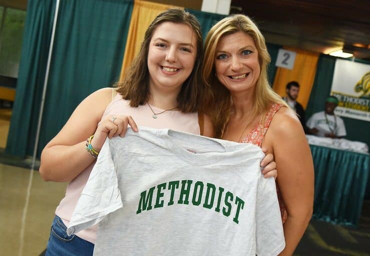 Freshman Josie Samuelian poses with a t-shirt at New Student Orientation