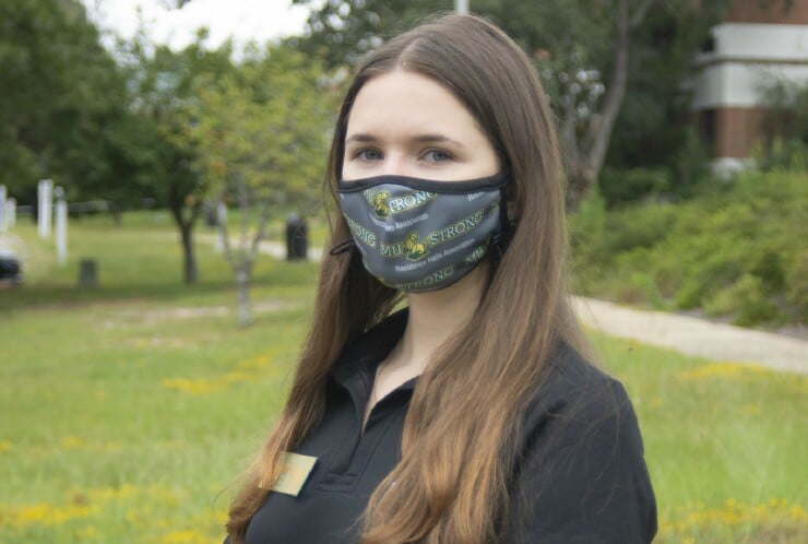 Student Kseniia Petrova wears a mask