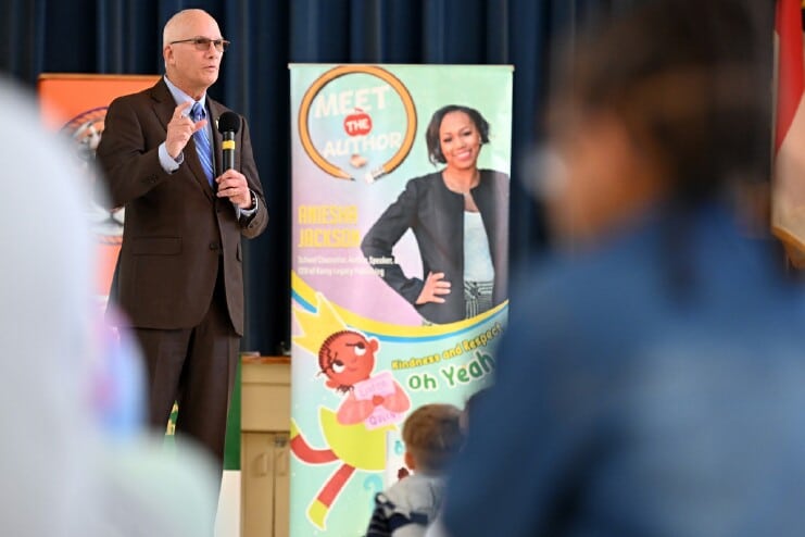 Methodist University President Stanley T. Wearden speaks to hundreds of young students at Margaret Willis Elementary School's gymnasium during the University's "Love of Literacy" event.