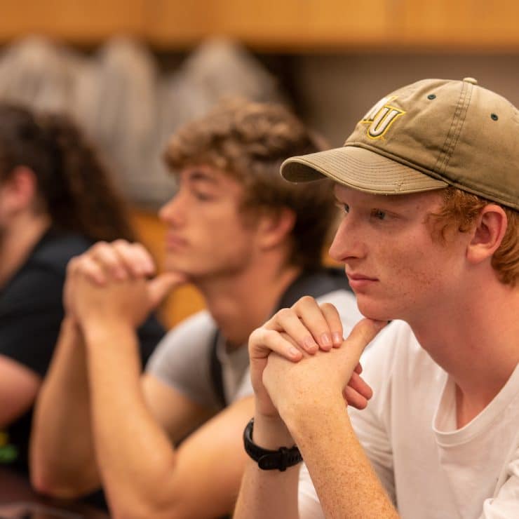 A few Engineering students listen to their instructor during a class at Methodist University