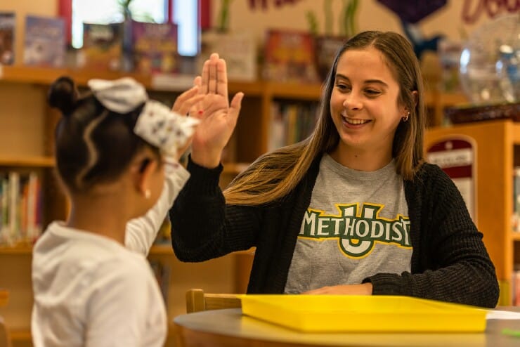 MU Student works with an elementary student