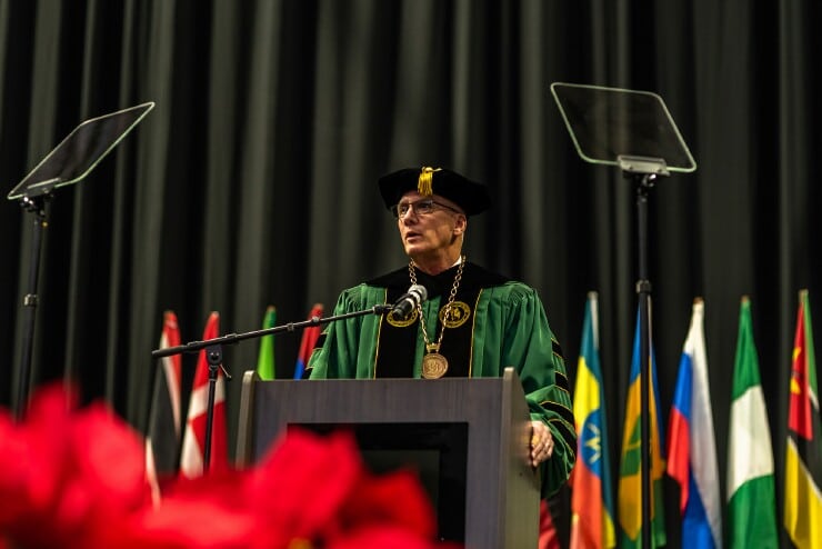 MU President Stanley T. Wearden welcomes graduates and the crowd to MU’s Winter Commencement.