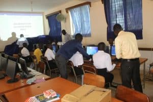 Students use the new computers and projector