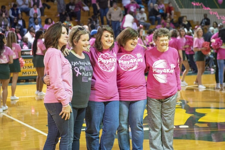 Cancer survivors on the court at halftime