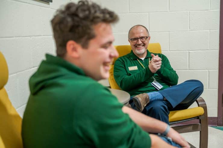 Mark Gronski chats with a student