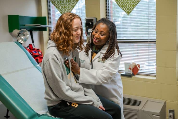 Lynetta Allen-Geddie examines a student