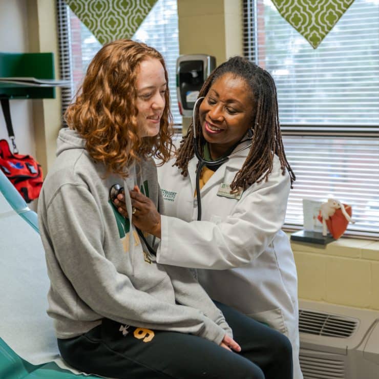 Lynetta Allen-Geddie examines a student