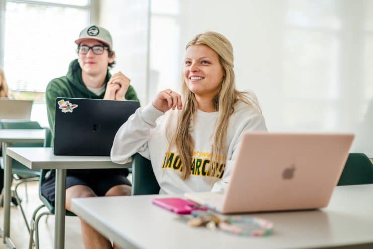 Methodist University Human Resource Management student sit in class