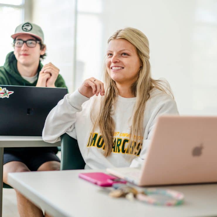 Methodist University Human Resource Management student sit in class