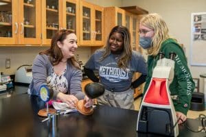 Professor Meghan Hennessey with her biology students.