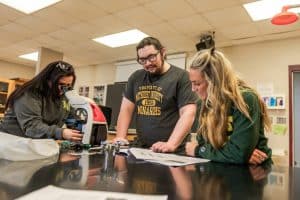 MU students engaged in biology lab work